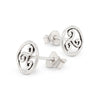 Pair of silver earrings with intricate designs on a white background