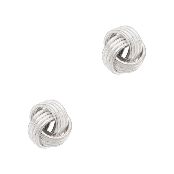 Pair of silver knot earrings on a white background