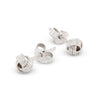 Silver knot-shaped earrings on a white background