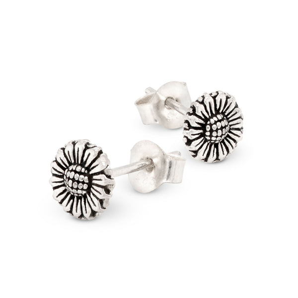 Silver sunflower stud earrings on a white background