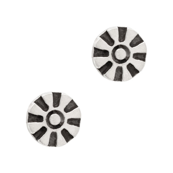 Pair of round earrings with black and white striped design on a white background