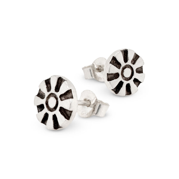 Silver earrings with black and white pattern on a white background