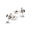 Pair of silver stud earrings on a white background