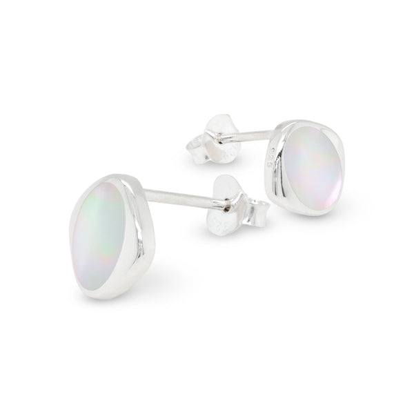Silver earrings with mother of pearl shells on a white background