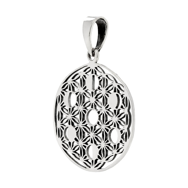 Silver pendant with intricate cut-out design on a white background