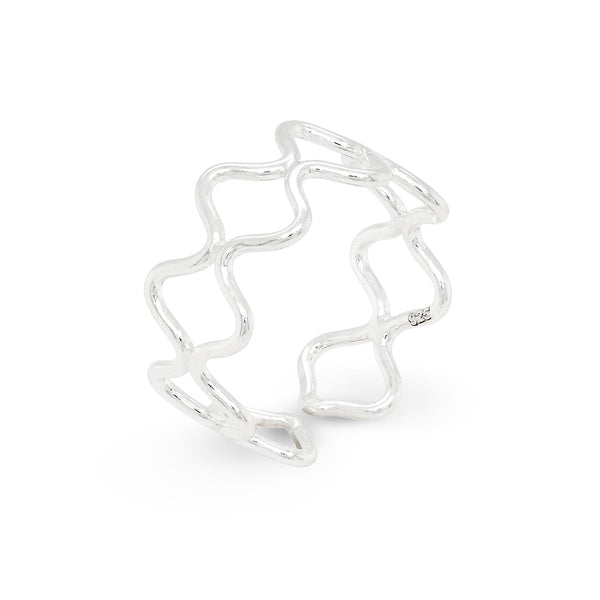 Silver toe ring with a wavy design on a white background